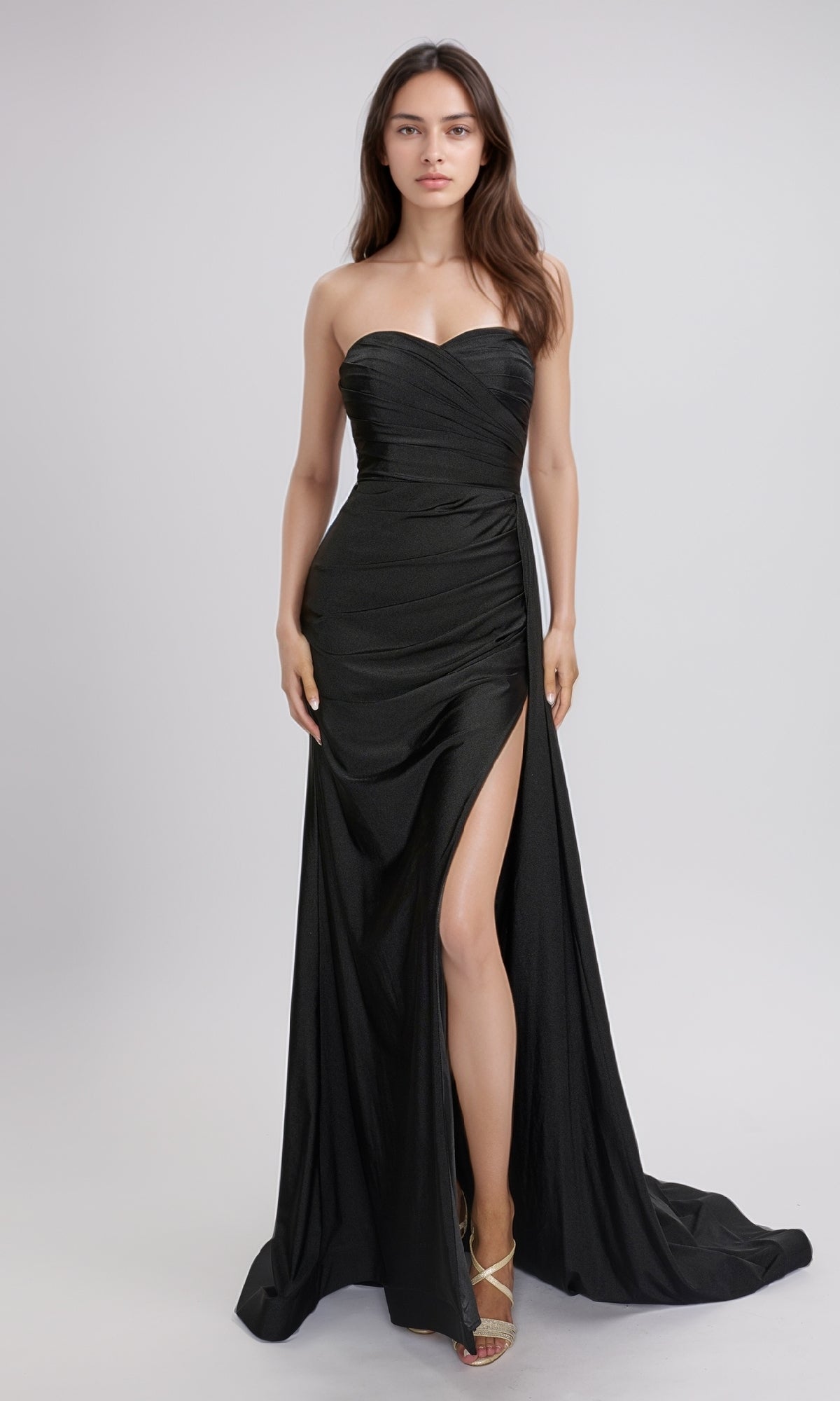 A woman wears the Nina Canacci 6686 long formal dress, featuring a strapless sweetheart neckline and a thigh-high slit, standing against a plain light background.